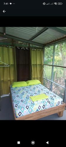 a bedroom with a bed in a tent at Alouatta Lodge and Canopy in Cahuita