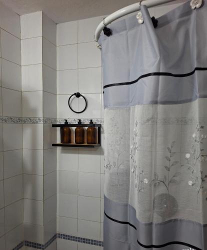 a shower curtain in a bathroom with a tub at Alojamiento Victoria in Corrientes