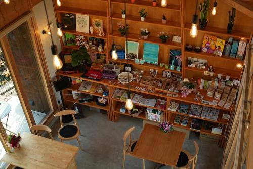 an overhead view of a cosmetics shop with tables and chairs at Mura Yado ARUMO in Ino