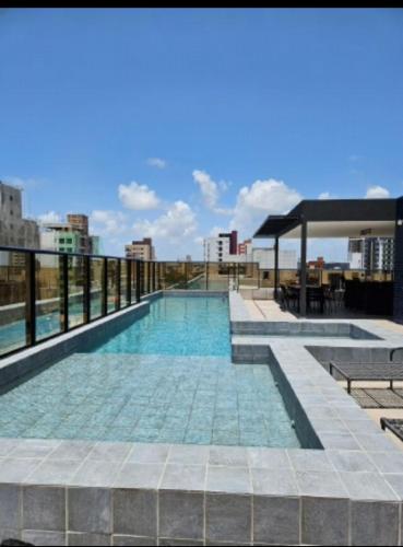 a swimming pool on the roof of a building at Flat Azzure 205 in Cabedelo