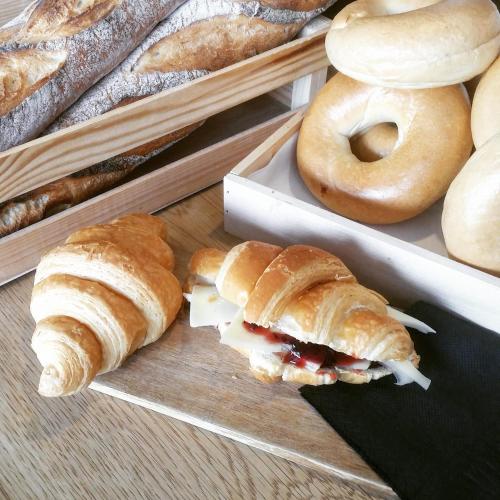 a tray with croissants and bagels on a table at Sofouli Suites in Nicosia