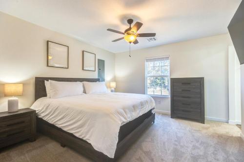 a bedroom with a bed and a ceiling fan at Stylish New Construction Home in Salina