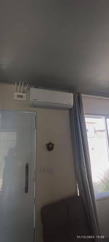 a room with a door and a window in a train at Casa Belíssima in Pelotas