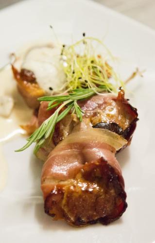 a white plate with a piece of food on it at Penzion Franko in Zvolen