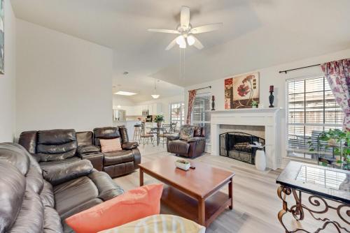 a living room with leather furniture and a fireplace at 4BD Cozy Frisco Fun Stay! in Frisco
