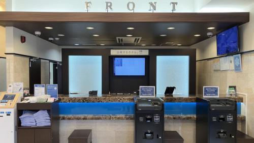 a store with two payment machines in a store at Toyoko Inn Toride-eki Higashi-guchi in Toride