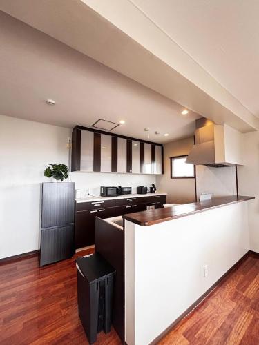 a kitchen with a counter top in a room at The Villa Lino in Yomitan