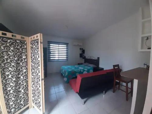 a living room with a couch and a bed at Nice apartment in the north in Hermosillo