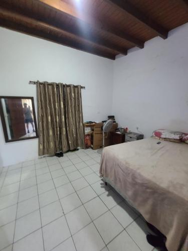 a bedroom with a bed and a tiled floor at Palm Beach 278 in Palm-Eagle Beach