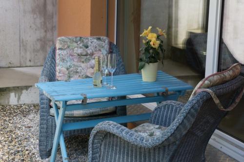a blue table and chairs on a patio at Chez Pio in Murten