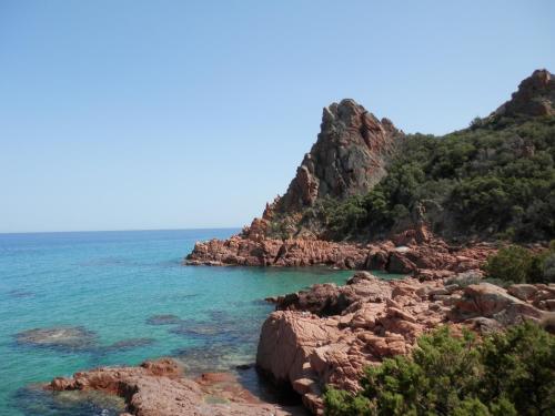 a view of the ocean from a rocky beach at Appartamento MareMontagna in Cardedu