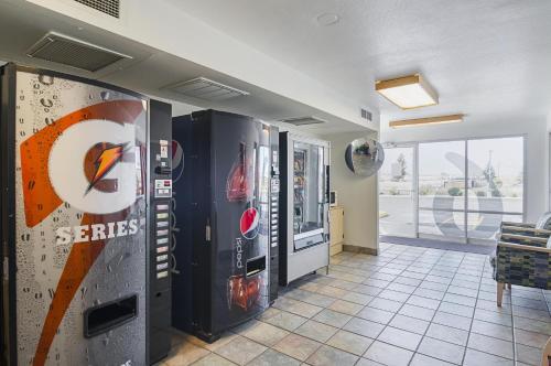 a room with two soda machines in a building at Motel 6-Laramie, WY in Laramie