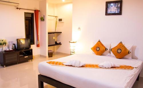 Postel nebo postele na pokoji v ubytování Pranburi Cabana Resort