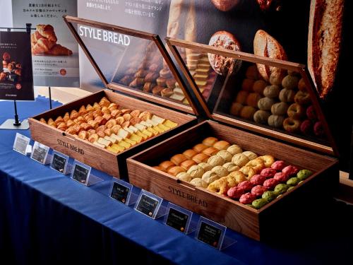 three boxes of different types of fruit on a table at Park Central Sakura Hotel in Osaka