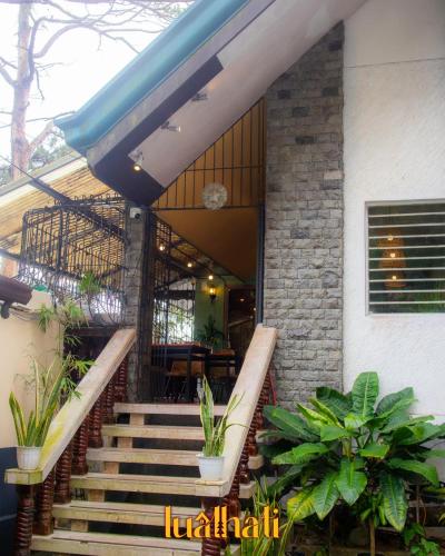 a staircase leading to a house with plants at Lualhati Homestay in Baguio