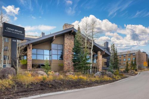 a building with a sign on the side of a road at Hilton Vacation Club Cedar Breaks Brian Head in Brian Head