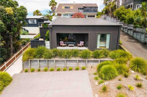 an aerial view of a house with a garden at Up Above The Crescent in Waihi Beach