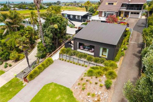 an aerial view of a house with a garden at Up Above The Crescent in Waihi Beach