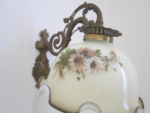 a lamp with flowers painted on the side of it at Guest House Veronika in Kočevje