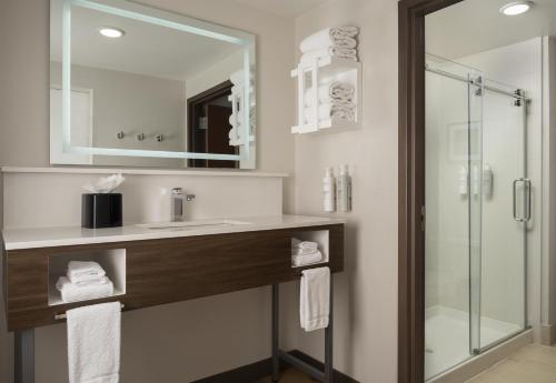 a bathroom with a sink and a shower at Hampton Inn & Suites - Mansfield in Mansfield