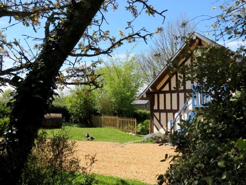 a view of a house from the garden at Le Chant Des Fees in Notre-Dame-de-Courson