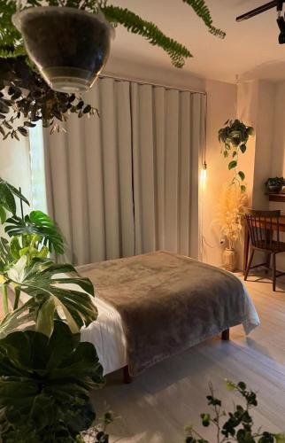 a bedroom with a bed and a large window at Private big ROOM 20mins to Airport, 5mins to station in St Albans