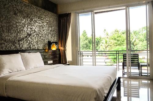 Кровать или кровати в номере Khaolak Suthawan Resort - SHA Plus