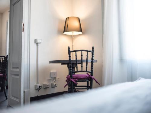 Postel nebo postele na pokoji v ubytování Palazzo Melfi
