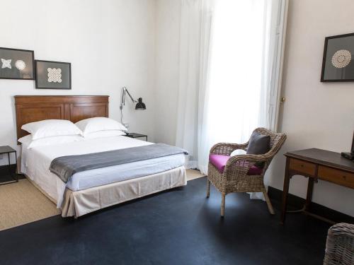 Postel nebo postele na pokoji v ubytování Palazzo Melfi