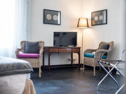 TV a/nebo společenská místnost v ubytování Palazzo Melfi