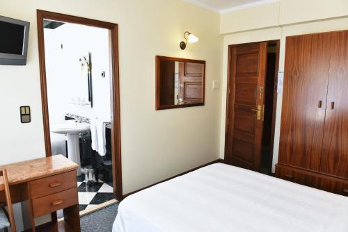 Un ou plusieurs lits dans un hébergement de l'établissement Hotel Aeroporto
