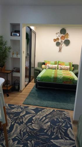 a living room with a bed and a couch at Studiou Elena in Lupeni