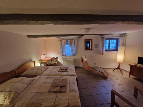 a large bedroom with a large bed in a room at Hotel Beere in Salzwedel