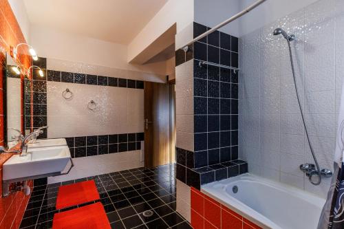 a bathroom with a sink and a bath tub at Gallis Villa in Pefkias