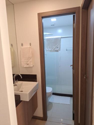 a bathroom with a toilet and a sink and a shower at Blue Hope, 467, LUXO em Vitória ES in Vitória