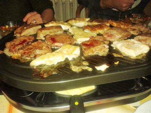 a bunch of food cooking in an oven at Hotel & Pension Aßmann in Hochkirch