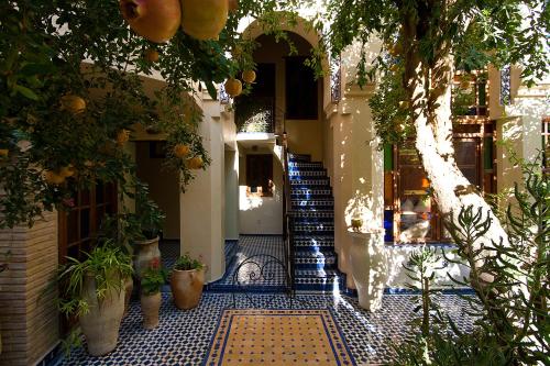 an entrance to a building with a blue and white tile floor at Ryad Salama in Fès