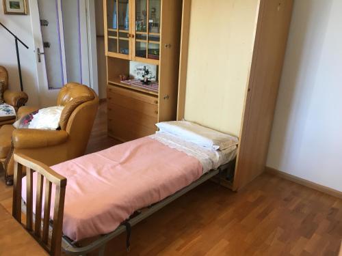 A Casa di Rita tesisinde bir odada yatak veya yataklar