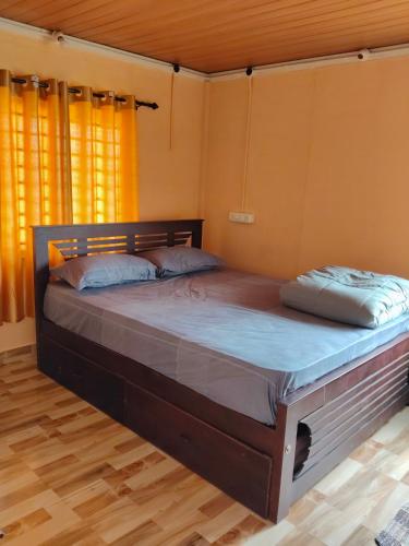 a bedroom with a large bed in a room at Airin's Villa in Agali