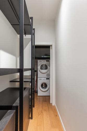 a laundry room with a washer and dryer at Luxury Calzolerie in Bologna
