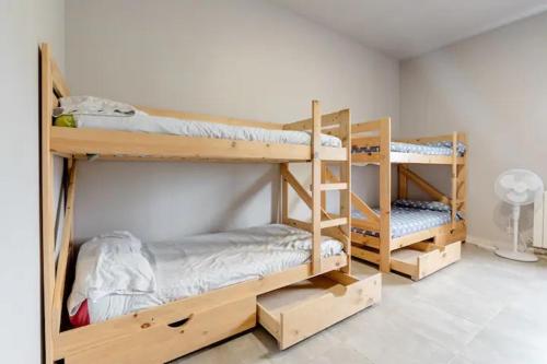 a room with three bunk beds in a room at Alarpe Aterpetxea BSS00035 in Zaldivia