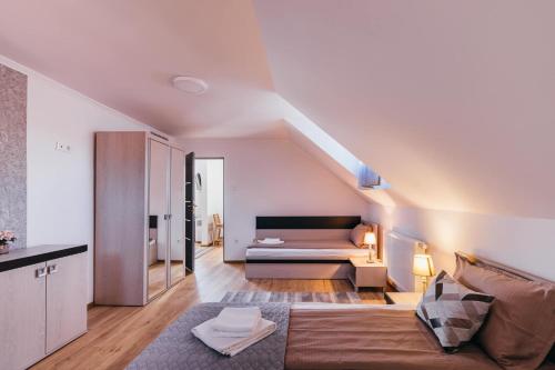 a living room with a couch and a table at Margareta Apartments in Odorheiu Secuiesc