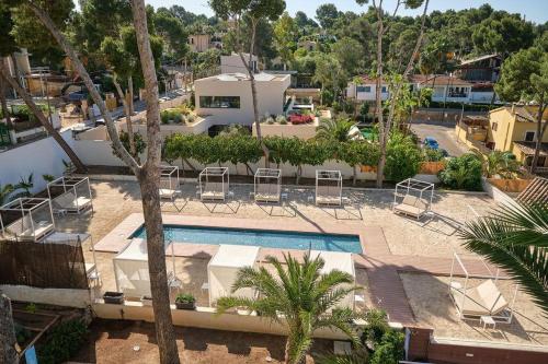 an aerial view of a resort with a swimming pool at Tacande Portals in Portals Nous