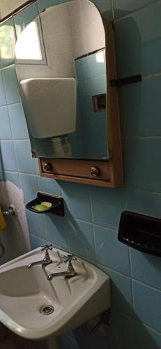 a bathroom with a sink and a mirror at Graciana Quequén in Necochea