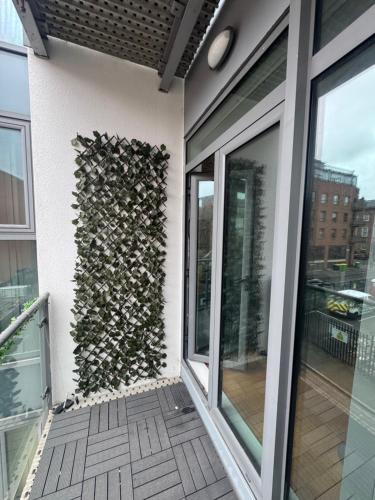 a wall of firewood on the side of a building at 2 Bedroom Apartment - Henry St Central Liverpool in Liverpool