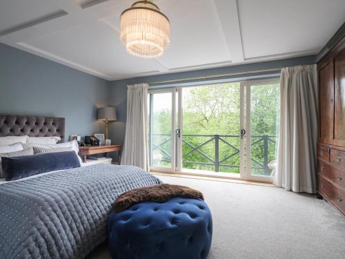 a bedroom with a large bed and a large window at 5 Bed in Devizes oc-s34742 in Devizes