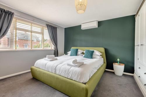 a bedroom with a large bed with blue walls at 2 Bed in Wool oc-r29949 in Wool