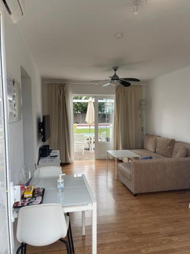 a living room with a couch and a table at Villas New Lanzasuites in Playa Blanca