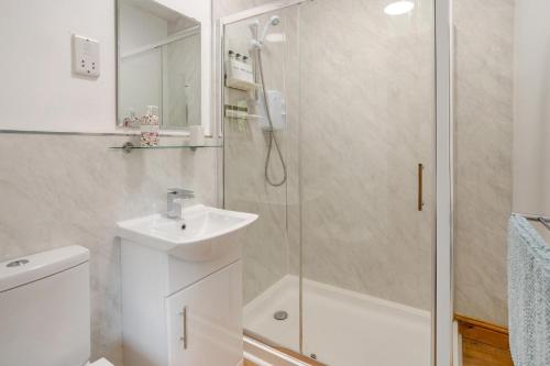a bathroom with a shower and a sink and a toilet at 2 Bed in Brecon oc-r33603 in Lower Chapel
