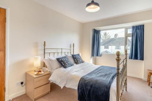a bedroom with a bed and a window at 3 Bed in Portinscale oc-w31059 in Portinscale